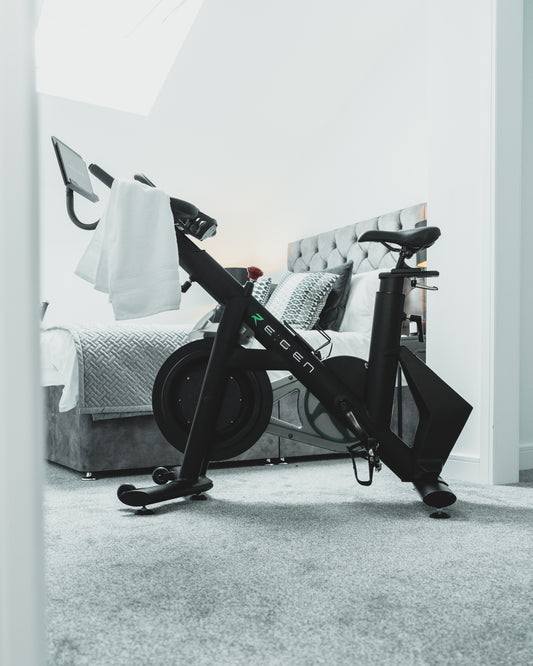 Energym RE:GEN bike in gray bedroom
